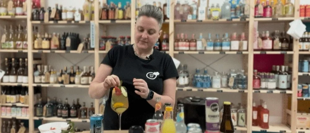 Laura making a summer cup alcohol-free pitcher cocktail
