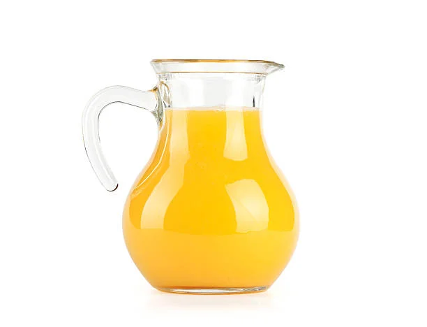 Orange juice in pitcher.