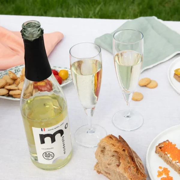 Moderato Colombard Cuvée Originale Sparkling Wine on table with food