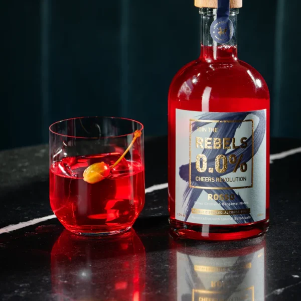 Rebels Rosso aperitif bottle with a cocktail in a glass